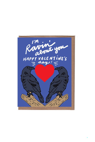 Valentine's Day card with two black birds framing a red heart and 'Ravin' about you'.