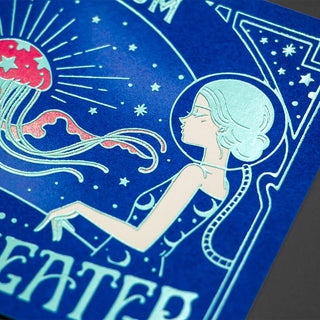 Close-up blue foil postcard art of woman profile, jellyfish, and starburst rays