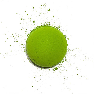 Bright green matcha powder mound with small flakes