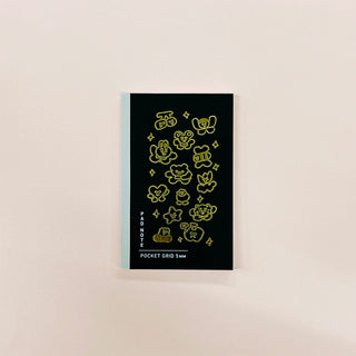 Pocket grid notebook cover in dark navy with yellow cloud doodles and PANDA label