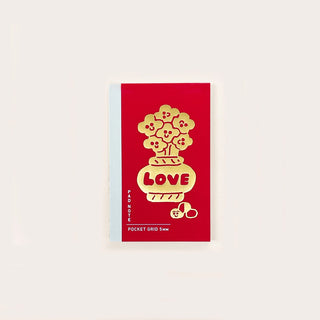 Pocket grid notebook cover in red with yellow tree bear clouds and LOVE text