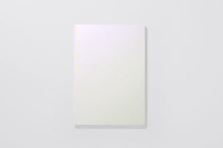 Aurora White notebook with subtle glossy highlight on the cover, top view