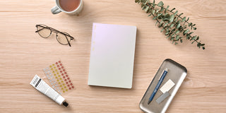 White notebook with blank page and smooth cover, top view