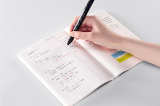 STÁLOGY A5 lined notebook open with hand writing notes