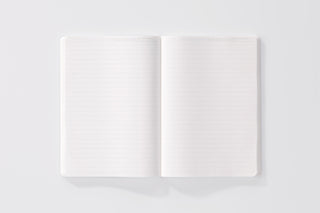 STÁLOGY 018 lined A5 editor's notebook, open to two blank lined pages