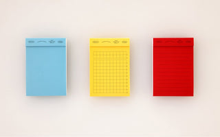 STÁLOGY 026 memo pads in blue plain, yellow grid, and red lined pads