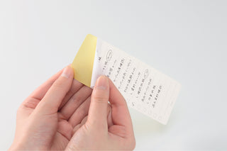 STÁLOGY removable to-do stickers held in hand