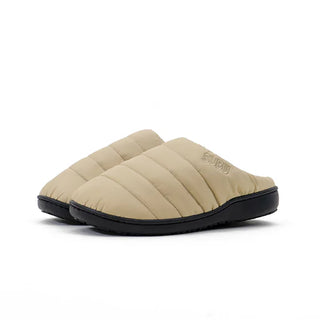 Beige quilted slip-on slippers with cushioned black rubber sole