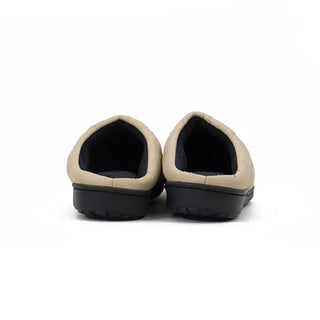 Beige slippers with dark lining and black rubber sole