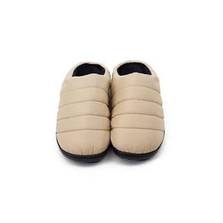 Beige quilted slip-on slippers, back view with black-lined openings