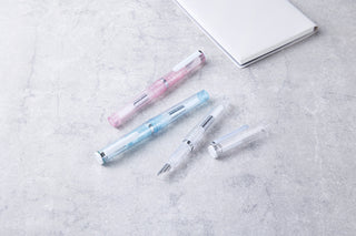 Glassy fountain pen set with pink, light blue, and clear barrels