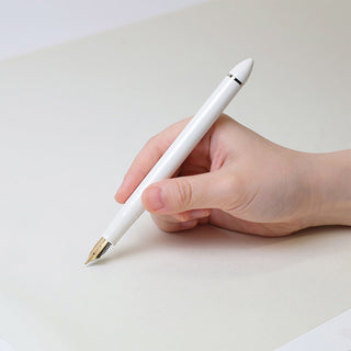 Pearl white fountain pen with 40-degree angled nib and gold trim