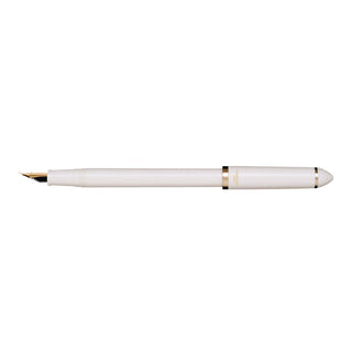 Pearl white fountain pen with gold trim and angled nib
