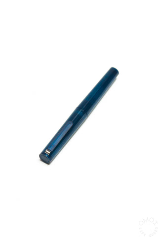 Translucent dark blue capped fountain pen with metal nib and clip