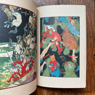 Open art book with two page illustrations featuring mythic creatures and people