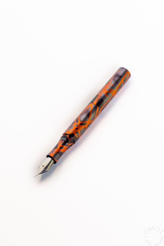 Orange smoke marbled fountain pen with metal nib and clear ink window