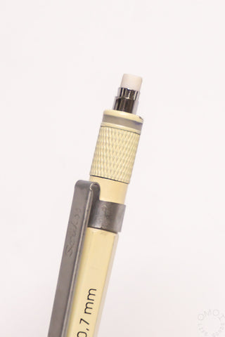 Close-up of beige mechanical pencil grip labeled 0.7mm