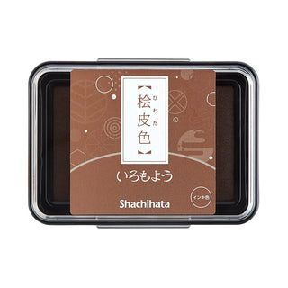 Large stamp ink pad with dark brown ink in clear lid and black base