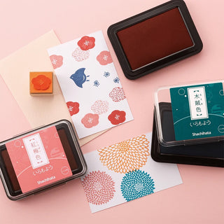 Shachihata large stamp ink pad in dark red, in a black rectangular case
