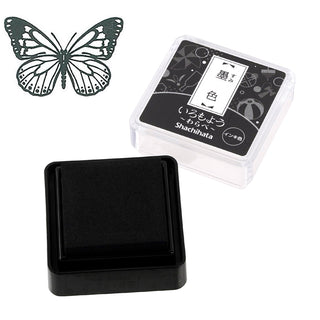 Shachihata mini stamp ink pad with dark ink cube, butterfly icon shown