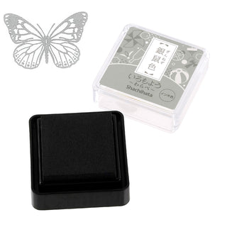 Black mini stamp ink pad in square black base with clear case lid