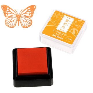 Red mini stamp ink pad in square black base with clear orange case