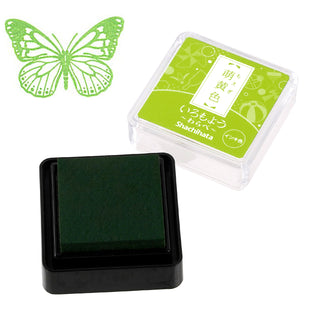 Green mini stamp ink pad in square black base with clear case lid