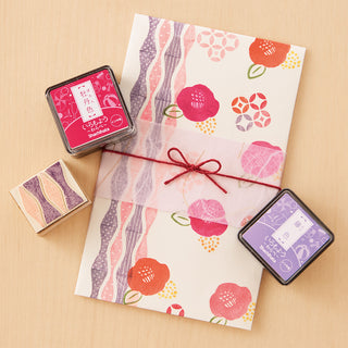 Mini stamp ink pad set with red and purple ink cubes and patterned papers