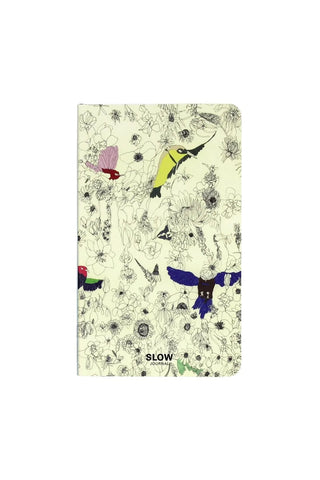 A6 slim open-dated diary with pale yellow bird-and-flower cover, multicolor birds and SLOW logo