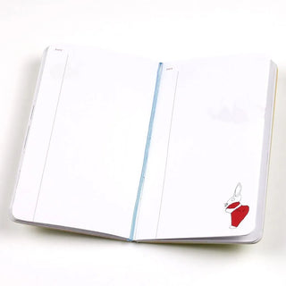 A6 slim open-dated diary opened flat with blue elastic band and small red bird on page