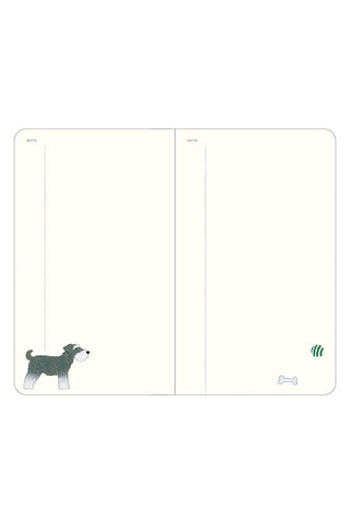 Open A6 diary pages with small animal illustrations in bottom corners