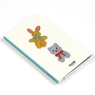 A6 slim diary cover with rabbit and cat drawings and teal spine edge