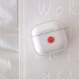 Single glossy puffy tomato sticker on clear case, round red character with green stem