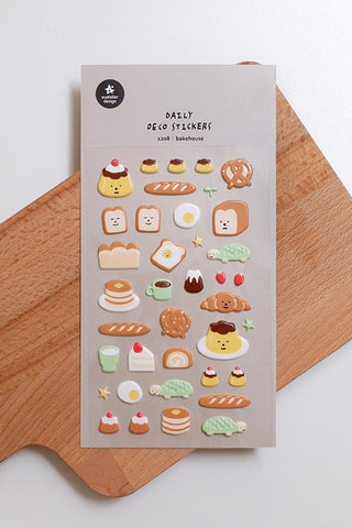 Puffy sticker sheet with assorted bakery desserts and pastries, cute faces and icons