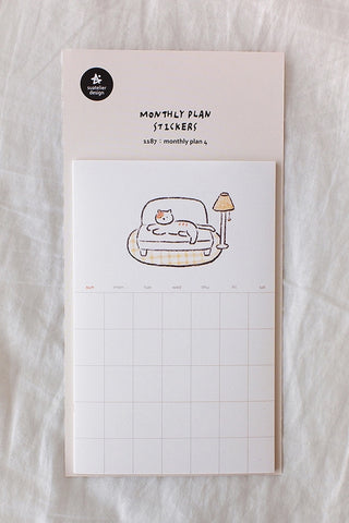 Monthly plan sticker sheet with cat illustration and grid calendar layout