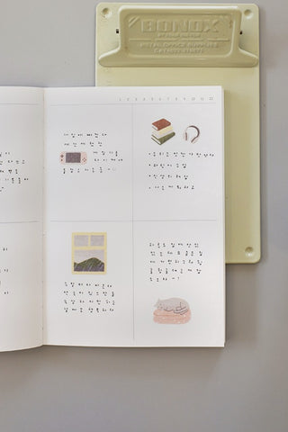Lazy Sunday sticker sheet page shown with food, headphones, books, and landscape icons