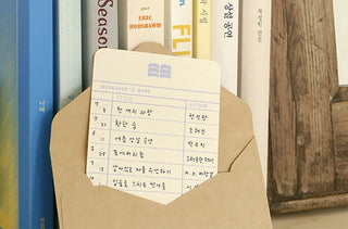 Sticker pack card showing a checklist-style sheet and envelope-shaped paper pieces.