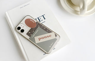 Sticker set with pastel labels and a large 'Pause' graphic on a phone case
