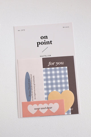 Sticker pack in pale pink and gray packaging with “on point” text and label art