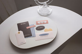 Sticker pack pieces with blue check patterns, hearts, and “for you” tags on a tray