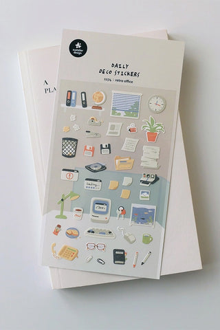 Retro office sticker sheet with desk, plant, clock, and stationery icons on paper
