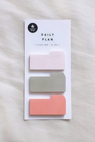 Daily plan sticky memo with three tabbed notes in white, pink stripes, and sage