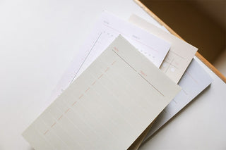 Set of cream To-Do sticky notes with printed checklist rows and orange accents