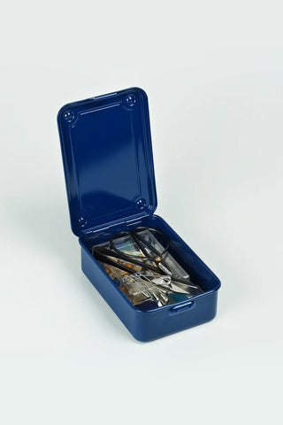 Indigo stackable storage box with open lid, showing metal tools inside.