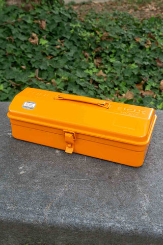 TOYO STEEL orange toolbox with top handle and front latch, closed design