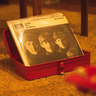 Red toolbox open with a vinyl record inside, front latch visible.