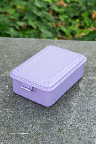 Lilac trunk-shaped toolbox with hinged lid and latch details
