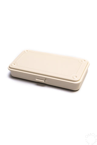 Trunk-shaped toolbox, off-white hinged lid and side latch details.