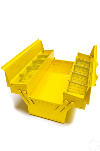 Yellow cantilever toolbox open, showing stepped storage compartments and rails