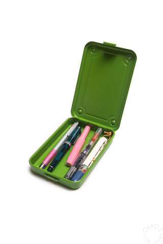 Matcha green trunk-shaped toolbox opened, lid fully raised, pens visible